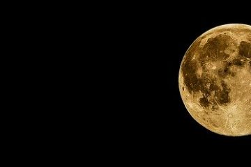 Full moon shining bright in the night depicting inspiration in dark times.