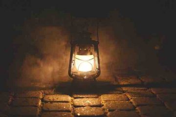 A lamp burning in the dark depicting both nostalgia and pain.
