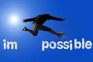 A man jumping with joy and I'm possible written in the sky depicting faith in oneself, hope, and optimism.