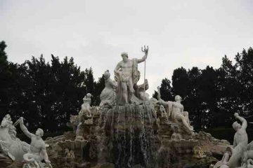 Statue of Zeus with other greek gods praising him.