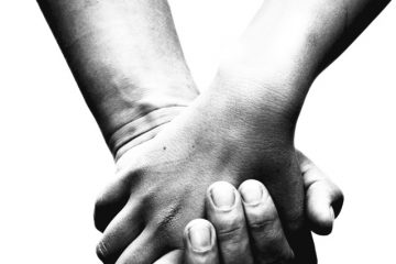 Image of holding hands of a couple depicting love and strong bond.