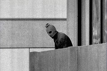 A Masked Black September Terrorist in the Apartment's balcony with Israeli hostages during the Munich Massacre