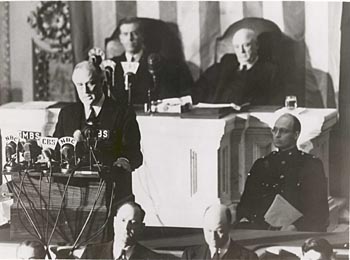 President Roosevelt delivering infamy speech after Pearl Harbor attack.